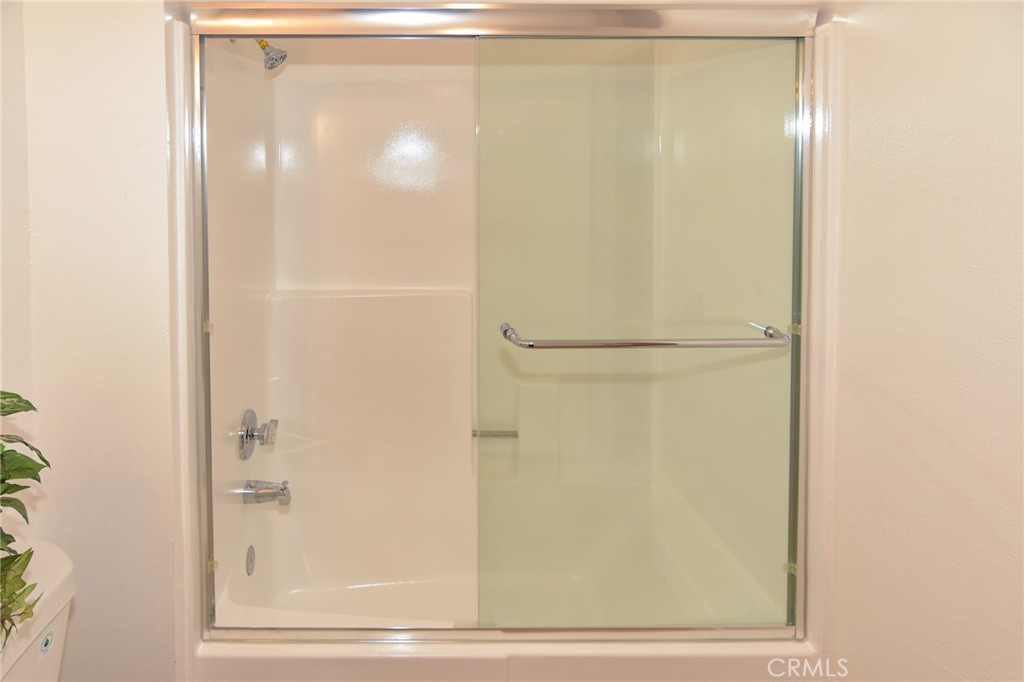1712 Pepper Street, Unit A Alhambra, CA 91801 - Photo 28 of 39 a bathroom with a glass shower door
