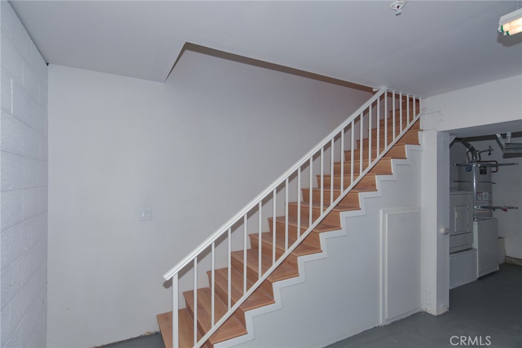 1712 Pepper Street, Unit A Alhambra, CA 91801 - Photo 33 of 39 a view of staircase with lots of frames on wall and entryway
