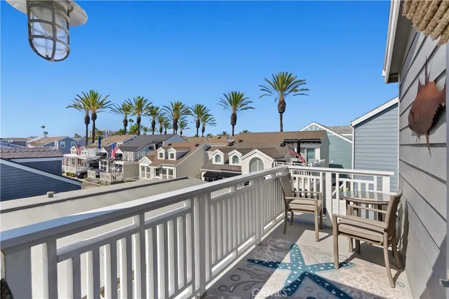 a view of balcony with furniture and potted plants