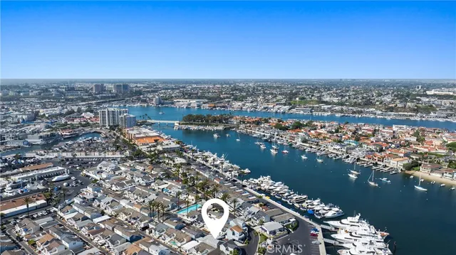 an aerial view of a houses with ocean view
