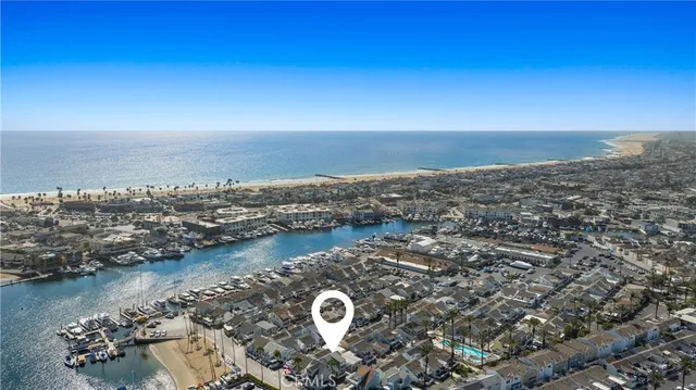 an aerial view of a house with a lake view