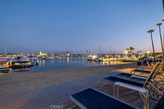 a view of a swimming pool with a table and chairs