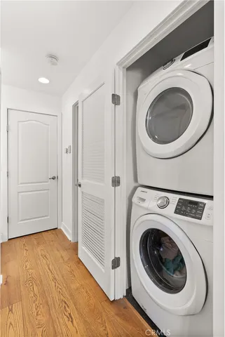 a view of a hallway with washer and dryer