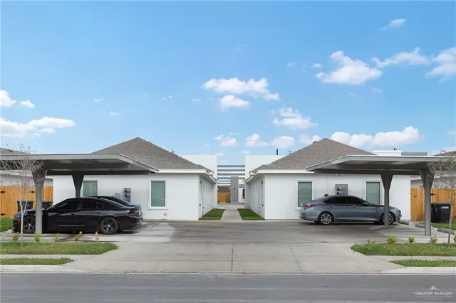 a front view of a house with garden and porch