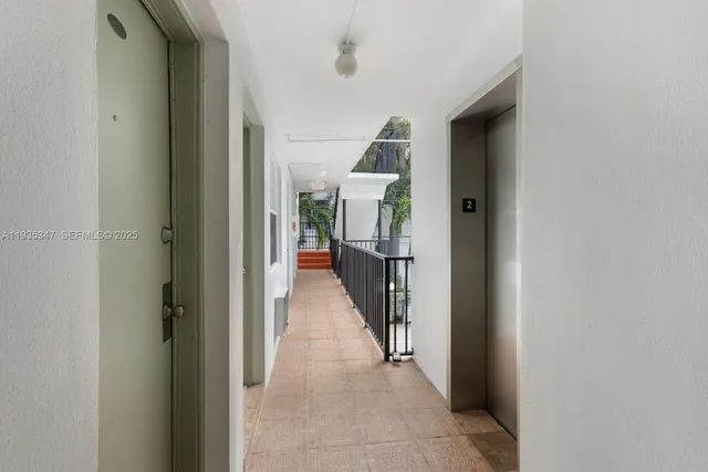 a view of a hallway with white walls