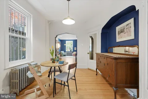 a dining room with furniture and window