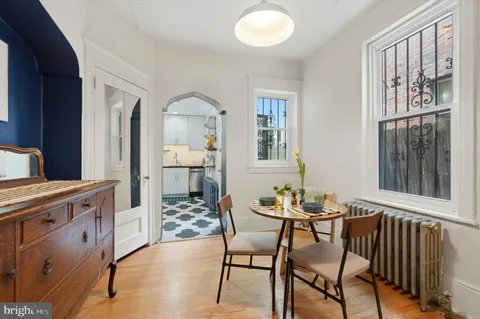 a dining room with furniture and window