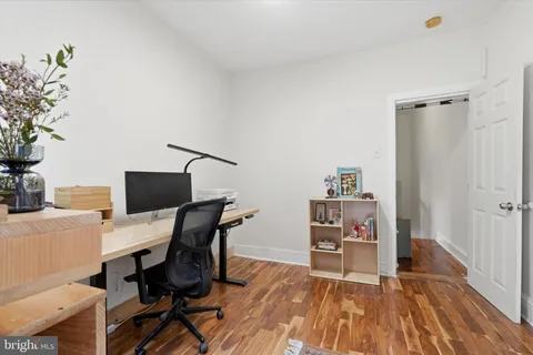 a workspace with furniture and wooden floor