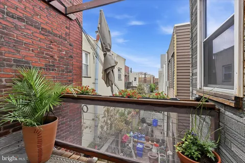 a view of a street with sitting area