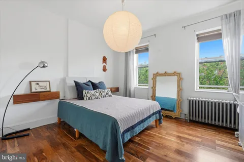 a bed room with a bed and a window