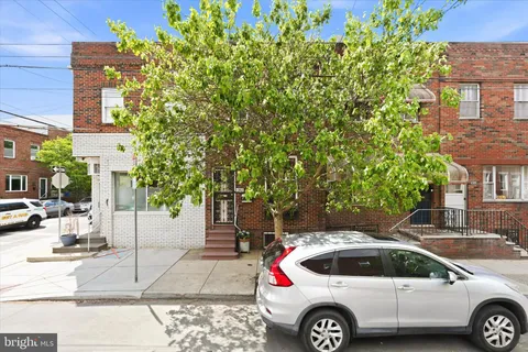 a front view of a house with parking space