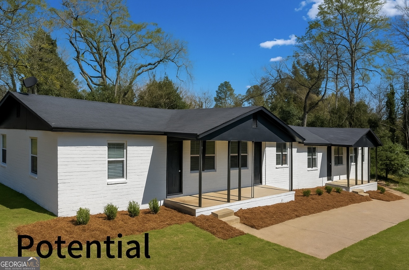 2155 Ferguson Street Macon, GA 31204 - Photo 1 of 17 a front view of a house with a yard