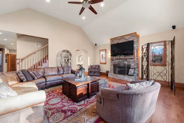 a living room with furniture and wooden floor