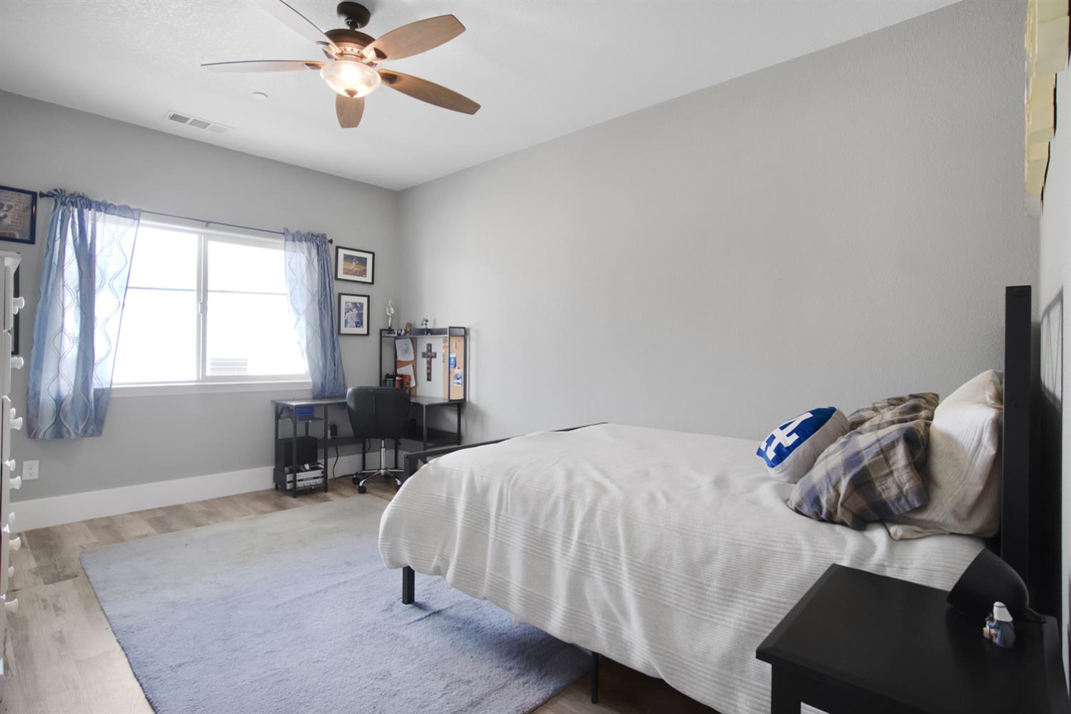 7991 South Shingle Road Shingle Springs, CA 95682 - Photo 41 of 58 a bedroom with a bed and a chandelier