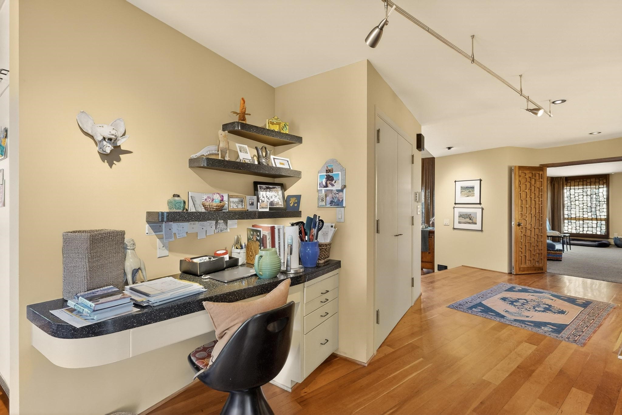 111 Barranca Road Santa Fe, NM 87501 - Photo 23 of 74 Office nook by the kitchen. Primary bedroom beyond.