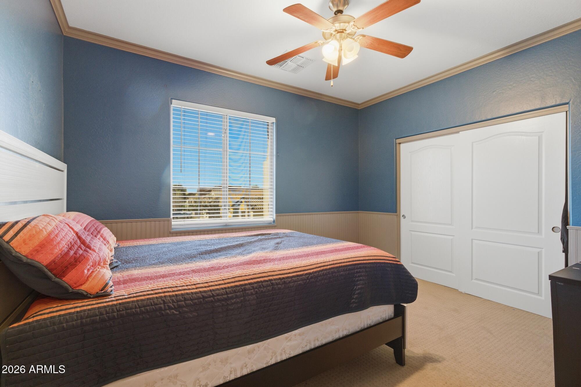 3605 South Danielson Way Chandler, AZ 85286 - Photo 11 of 23 a bedroom with a bed and a chandelier