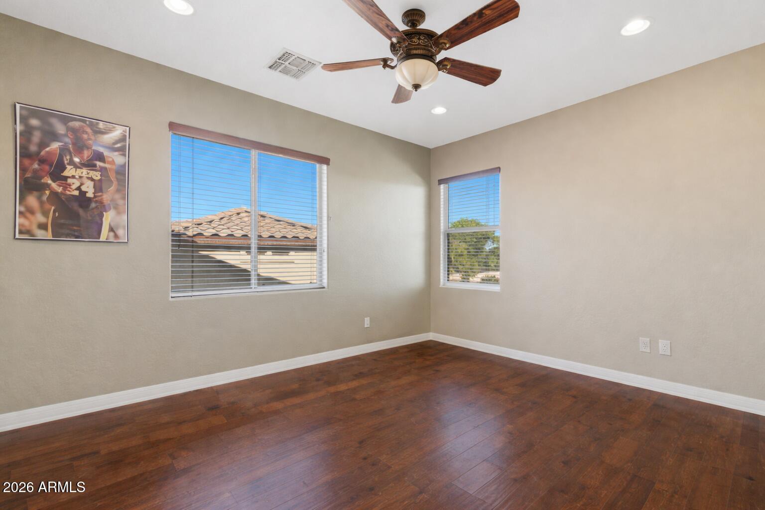 3605 South Danielson Way Chandler, AZ 85286 - Photo 13 of 23 a view of a big room with wooden floor and windows