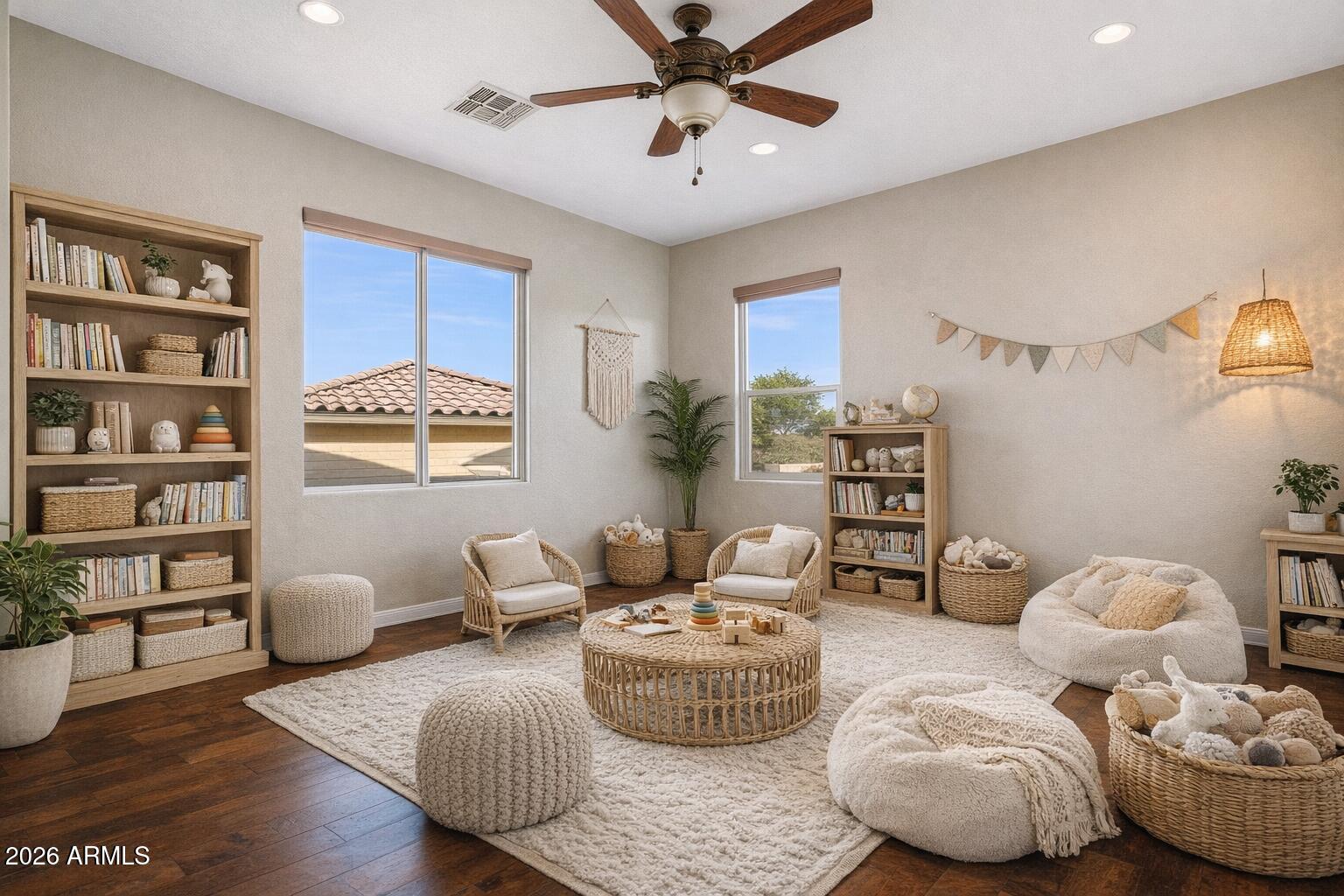 3605 South Danielson Way Chandler, AZ 85286 - Photo 14 of 23 a living room with furniture and a book shelf