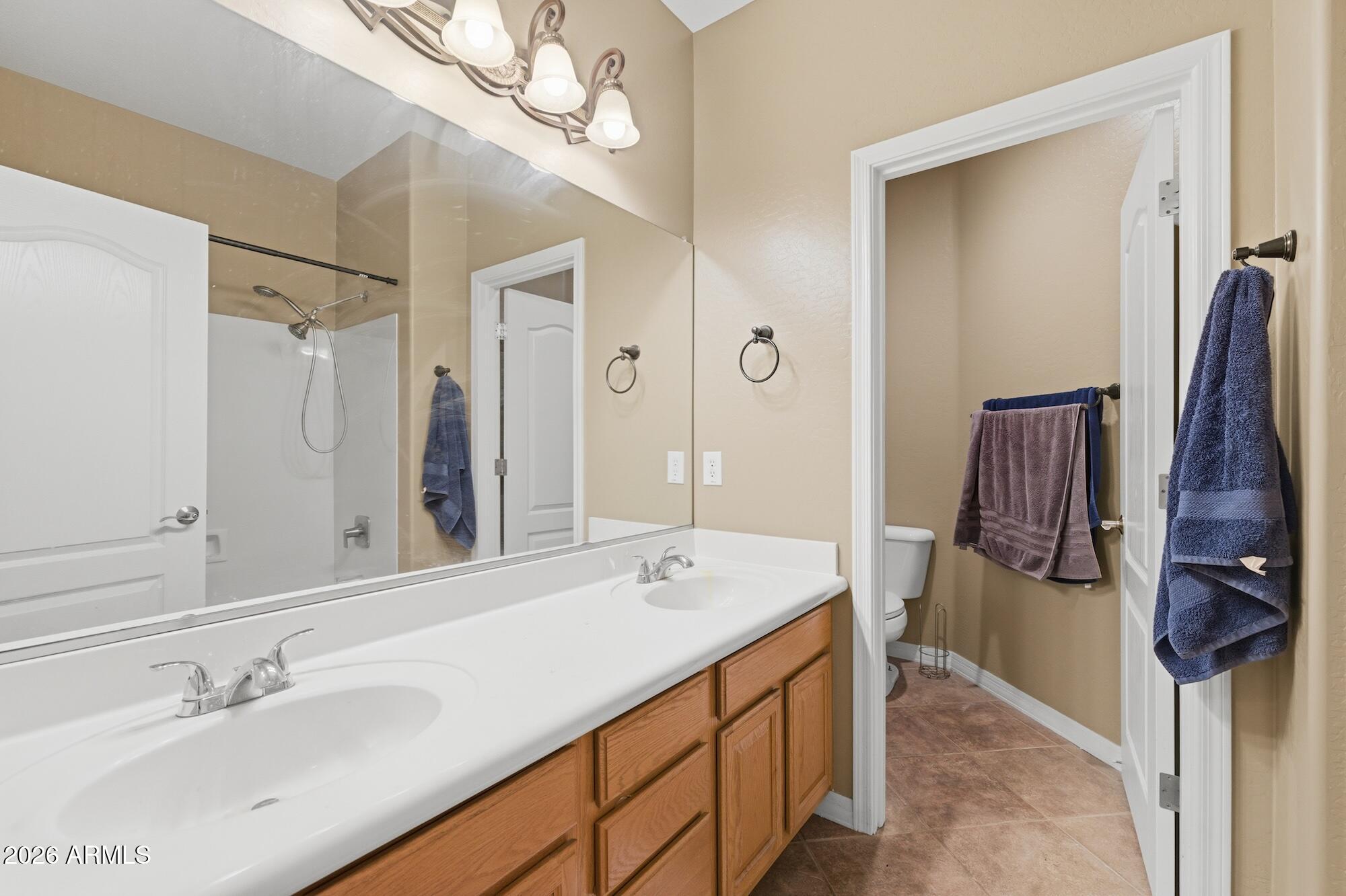 3605 South Danielson Way Chandler, AZ 85286 - Photo 15 of 23 a bathroom with a sink double vanity and a mirror
