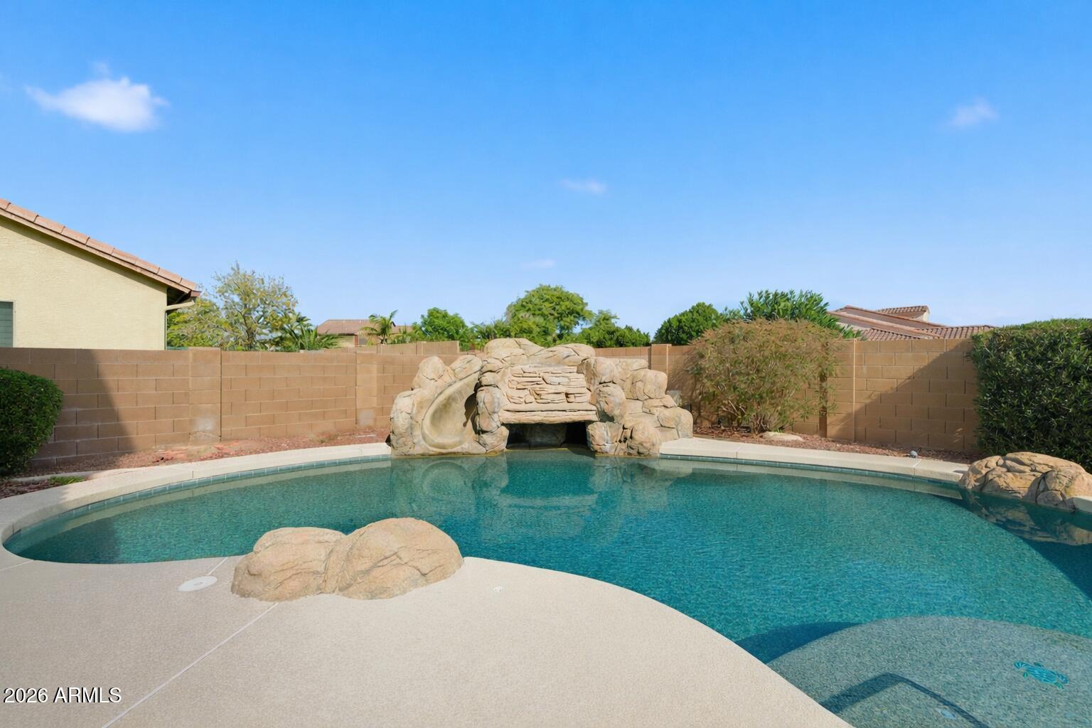 3605 South Danielson Way Chandler, AZ 85286 - Photo 18 of 23 a view of backyard with swimming pool and seating space