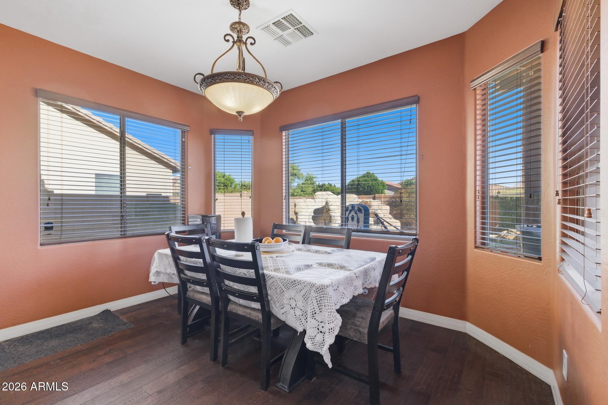 3605 South Danielson Way Chandler, AZ 85286 - Photo 8 of 23 a view of a dining room with furniture window and outside view