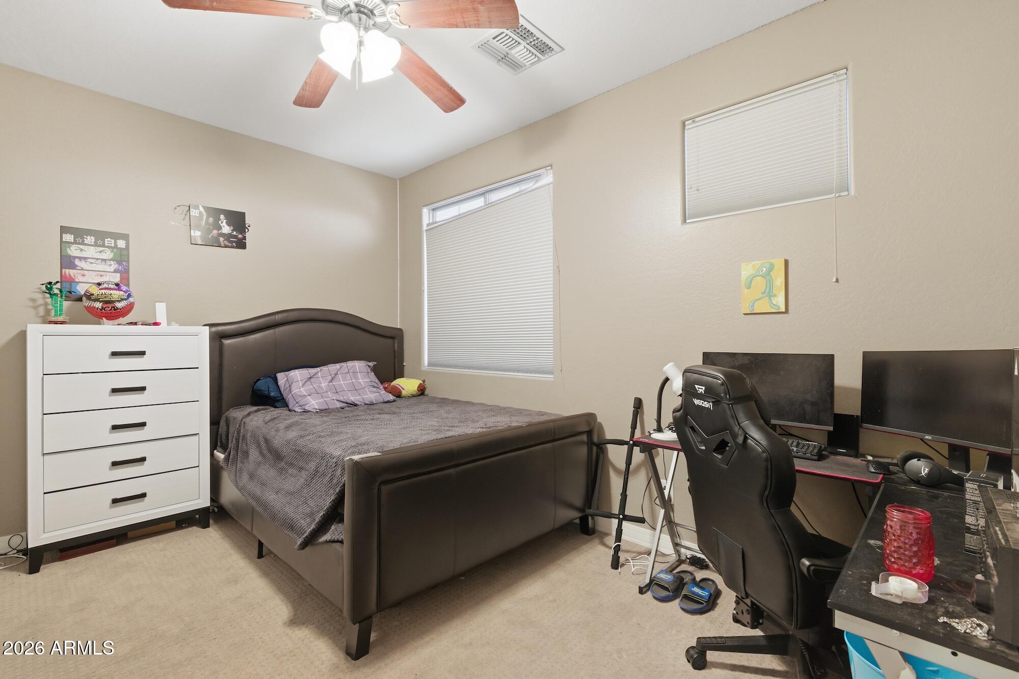 3605 South Danielson Way Chandler, AZ 85286 - Photo 10 of 23 a bedroom with a bed and a desk
