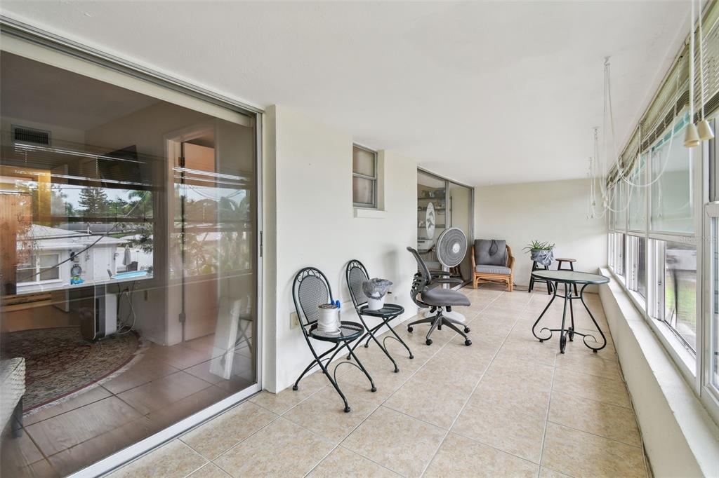9945 47th Avenue North, Unit 208 St. Petersburg, FL 33708 - Photo 15 of 38 a view of a livingroom with furniture and white walls