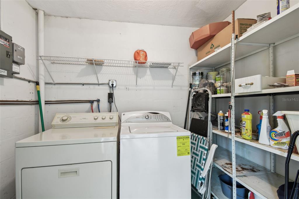 9945 47th Avenue North, Unit 208 St. Petersburg, FL 33708 - Photo 16 of 38 a utility room with dryer and washer