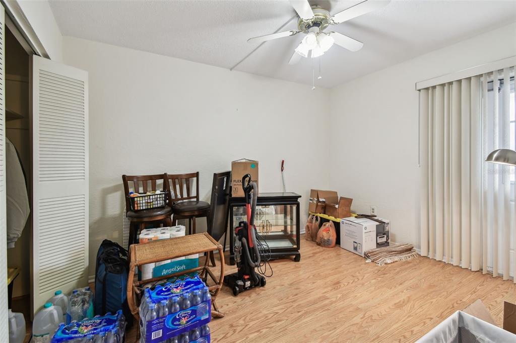 9945 47th Avenue North, Unit 208 St. Petersburg, FL 33708 - Photo 20 of 38 a view of a workspace with furniture and a window