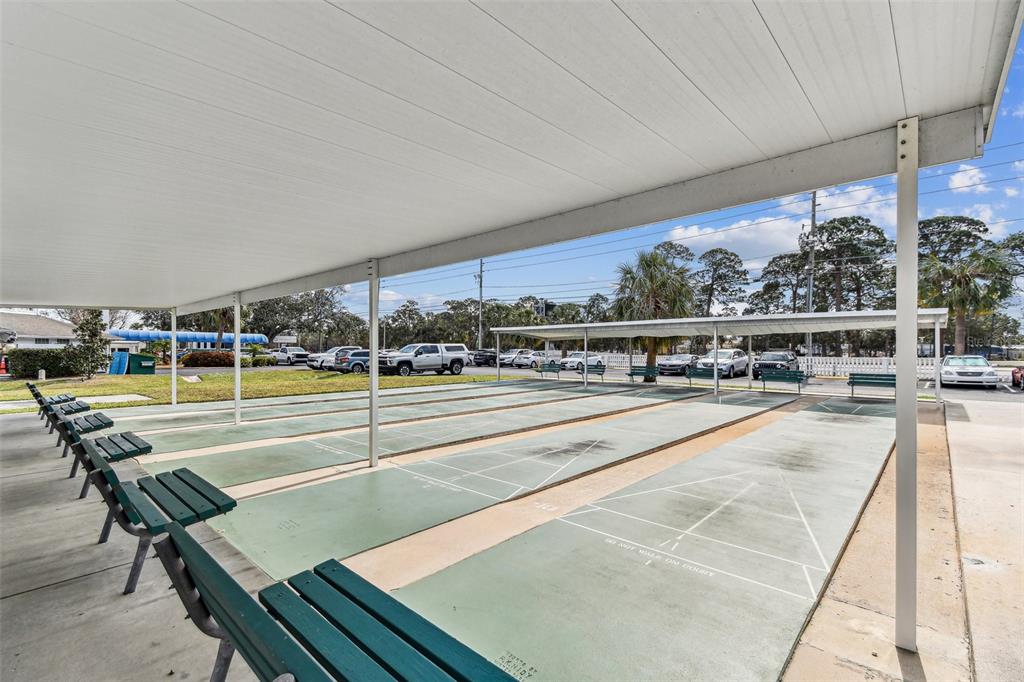 9945 47th Avenue North, Unit 208 St. Petersburg, FL 33708 - Photo 31 of 38 a view of a swimming pool and outdoor seating
