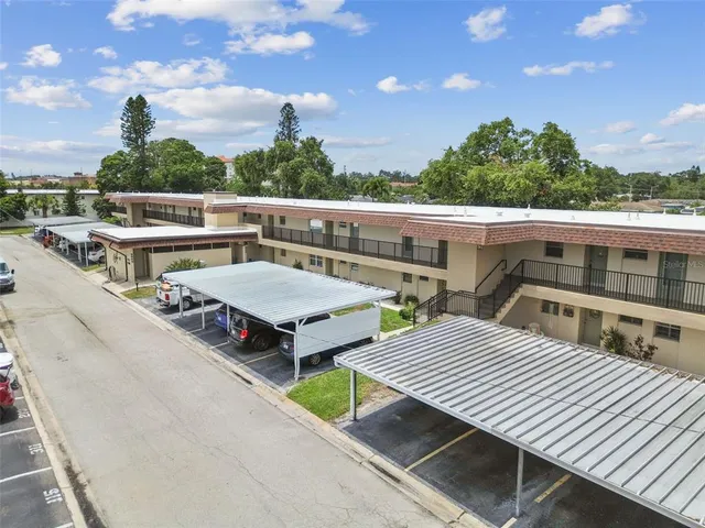 a view of a deck with wooden floor and iron stairs