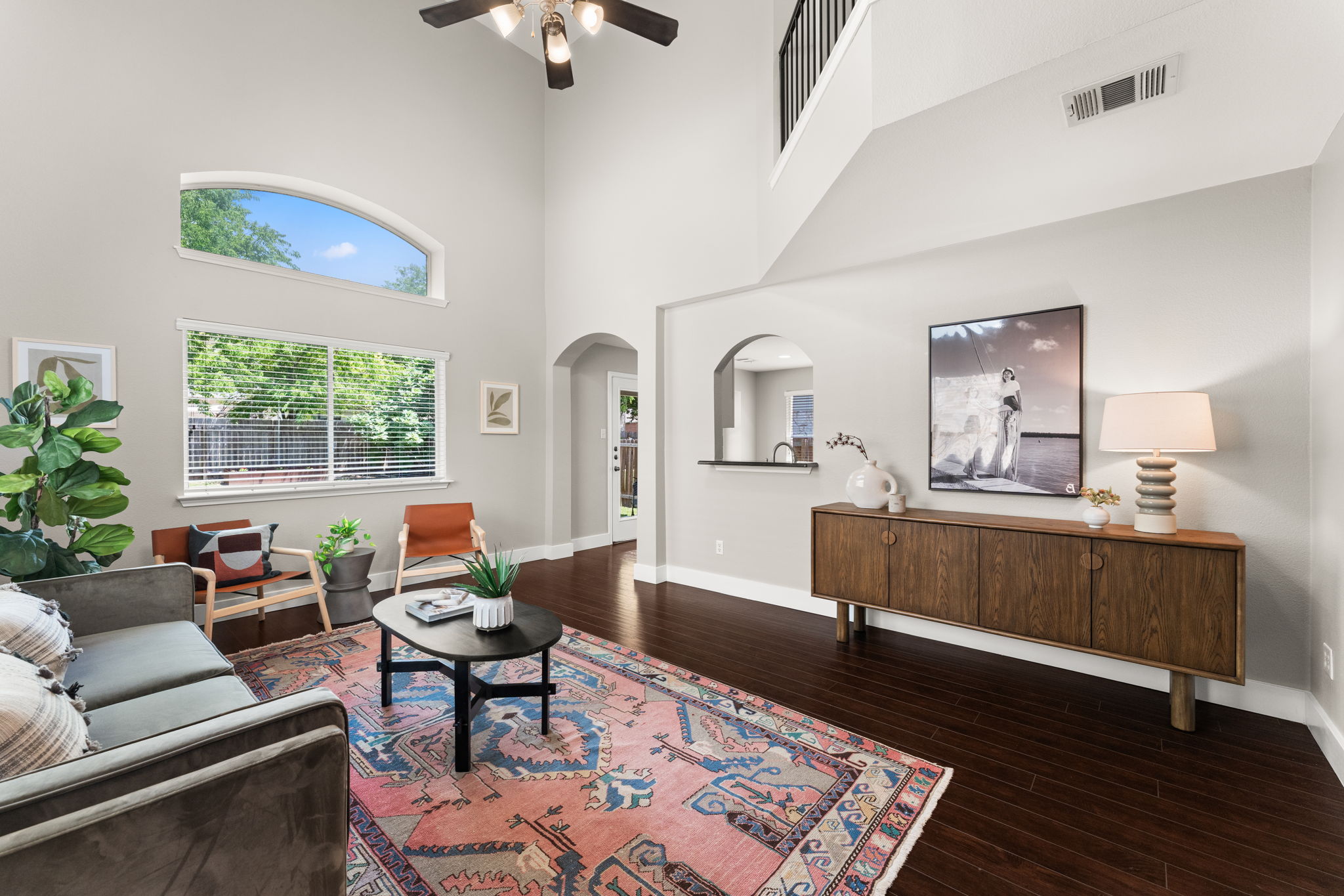 2500 Wilma Rudolph Road Austin, TX 78748 - Photo 1 of 1 Fabulous light and space in the living area with double height ceiling, wood look laminate floor, 5.5 inch baseboards and freshly painted interior.