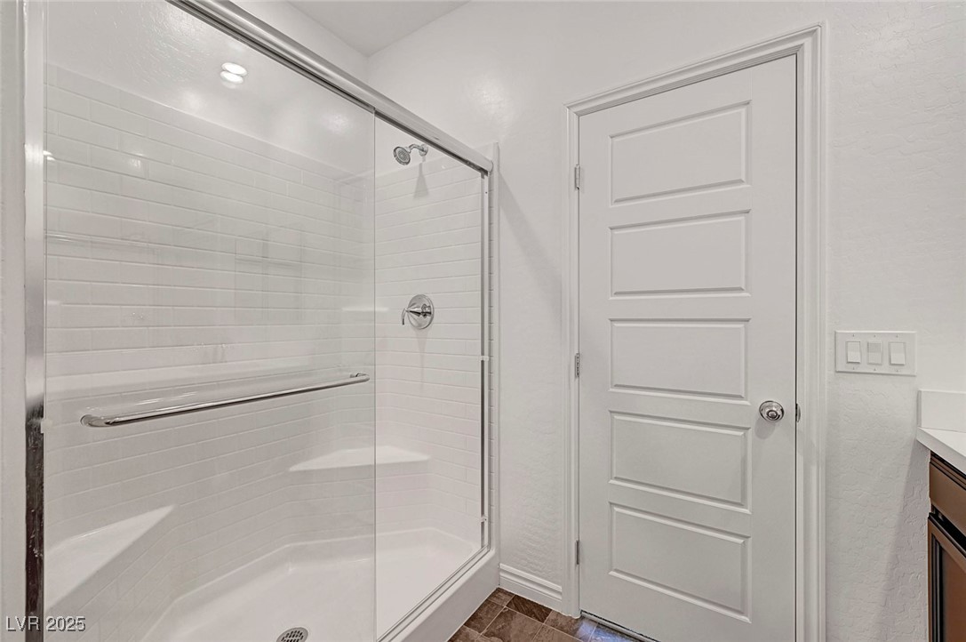 7204 North Decatur Boulevard North Las Vegas, NV 89084 - Photo 38 of 55 Bathroom with a shower stall and vanity