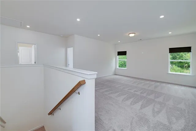 a view of an empty room with windows