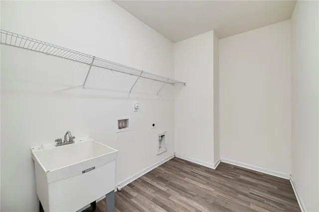 a view of a room with wooden floor