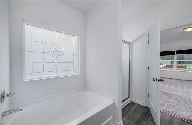 a white bath tub sitting in a bathroom