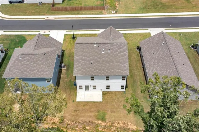 a view of swimming pool with a yard in the background