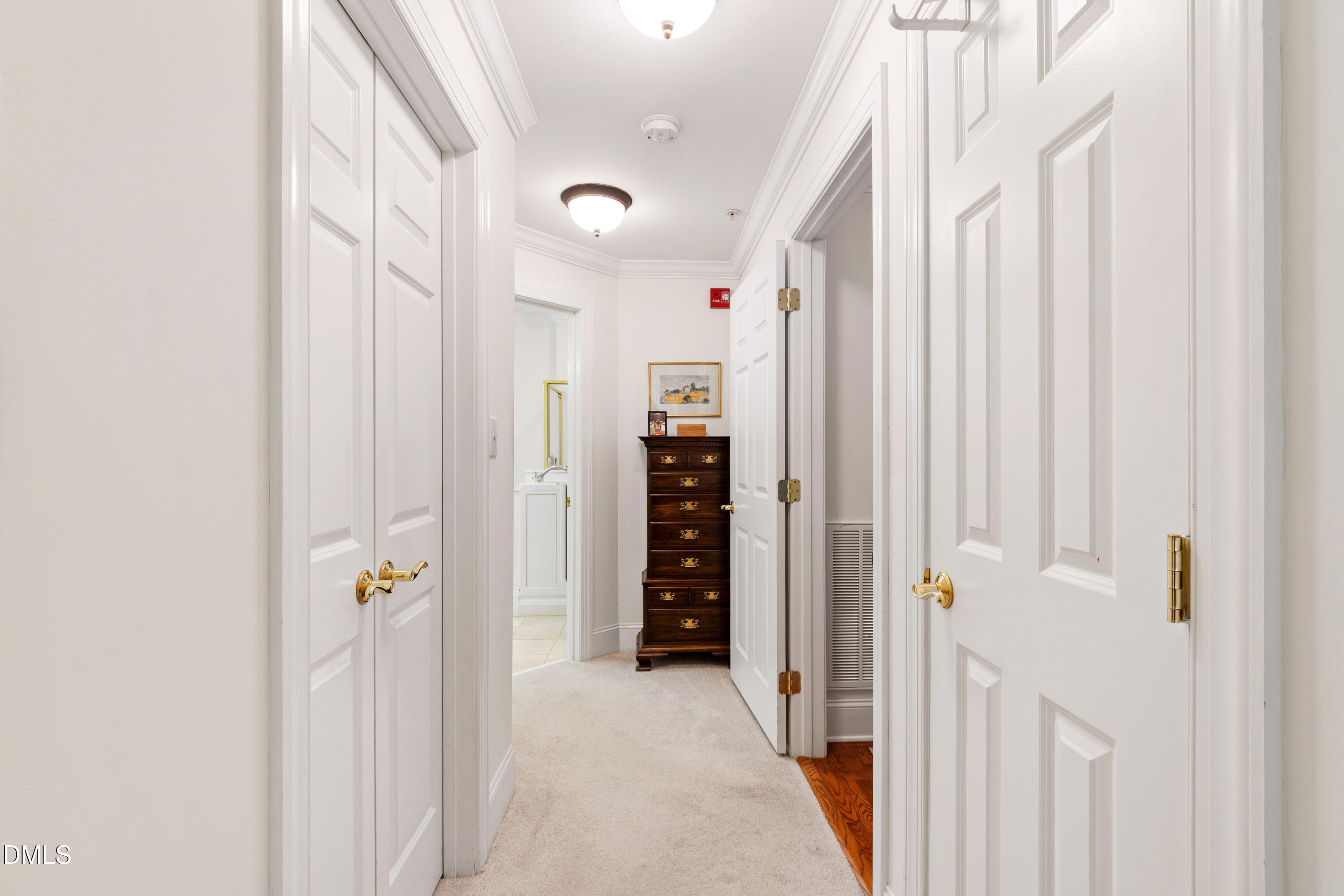 3700 Baron Cooper Pass, Unit 105 Raleigh, NC 27612 - Photo 20 of 49 a view of a hallway with wooden shelves