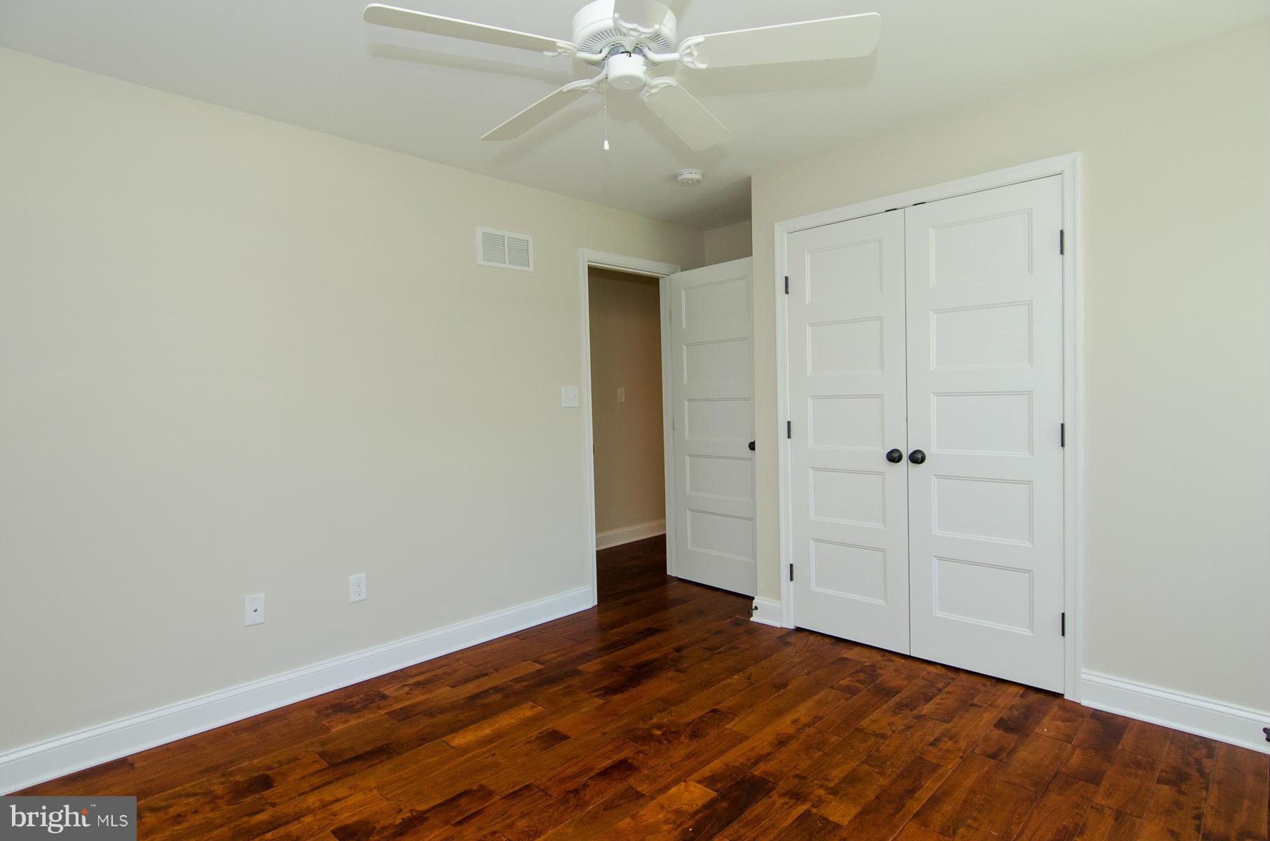 181 Hollen Road Baltimore, MD 21212 - Photo 14 of 30 a view of an empty room with wooden floor