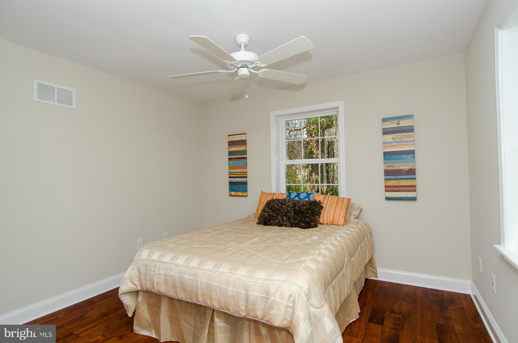 181 Hollen Road Baltimore, MD 21212 - Photo 8 of 30 a bedroom with a bed and window