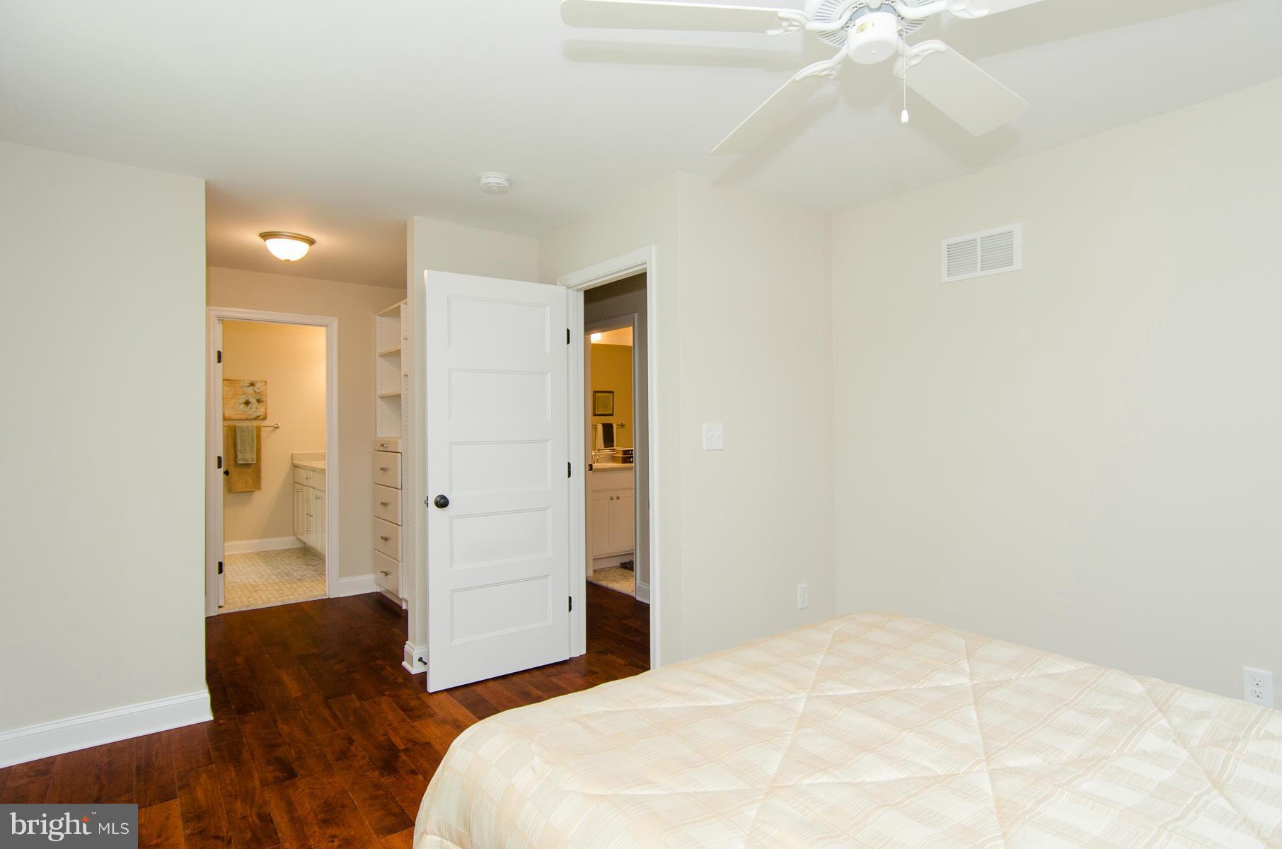 181 Hollen Road Baltimore, MD 21212 - Photo 9 of 30 a bedroom with a bed and a chandelier