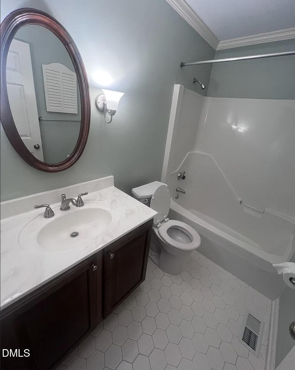 6403 Andsley Drive Raleigh, NC 27609 - Photo 12 of 21 a bathroom with a granite countertop sink and a mirror