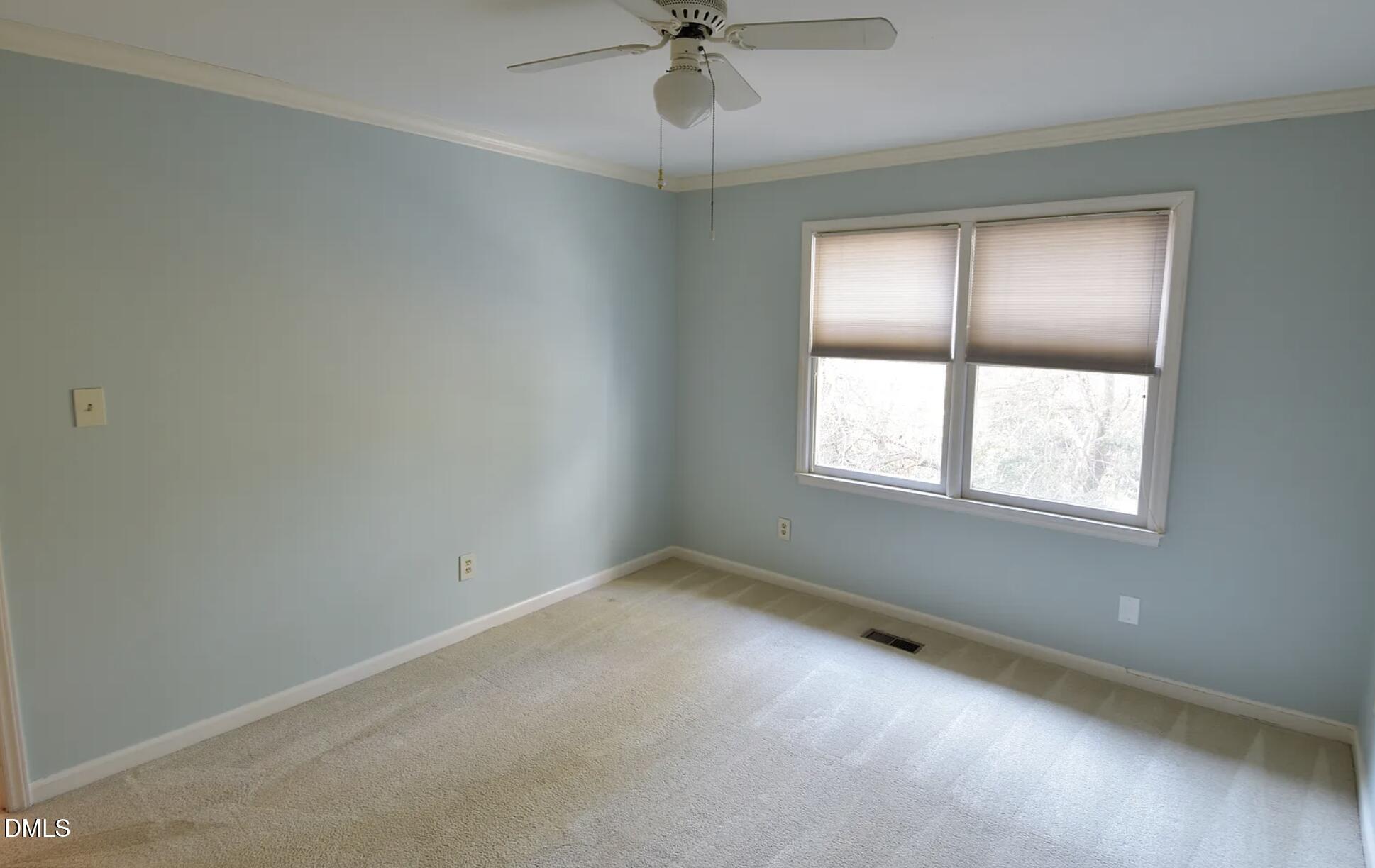 6403 Andsley Drive Raleigh, NC 27609 - Photo 18 of 21 an empty room with a window