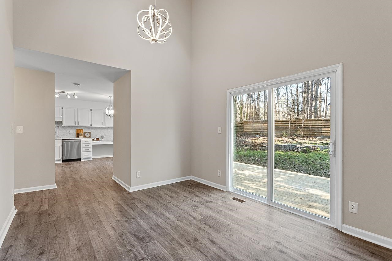5516 Middleton Road Durham, NC 27713 - Photo 14 of 35 a view of empty room with wooden floor and fan