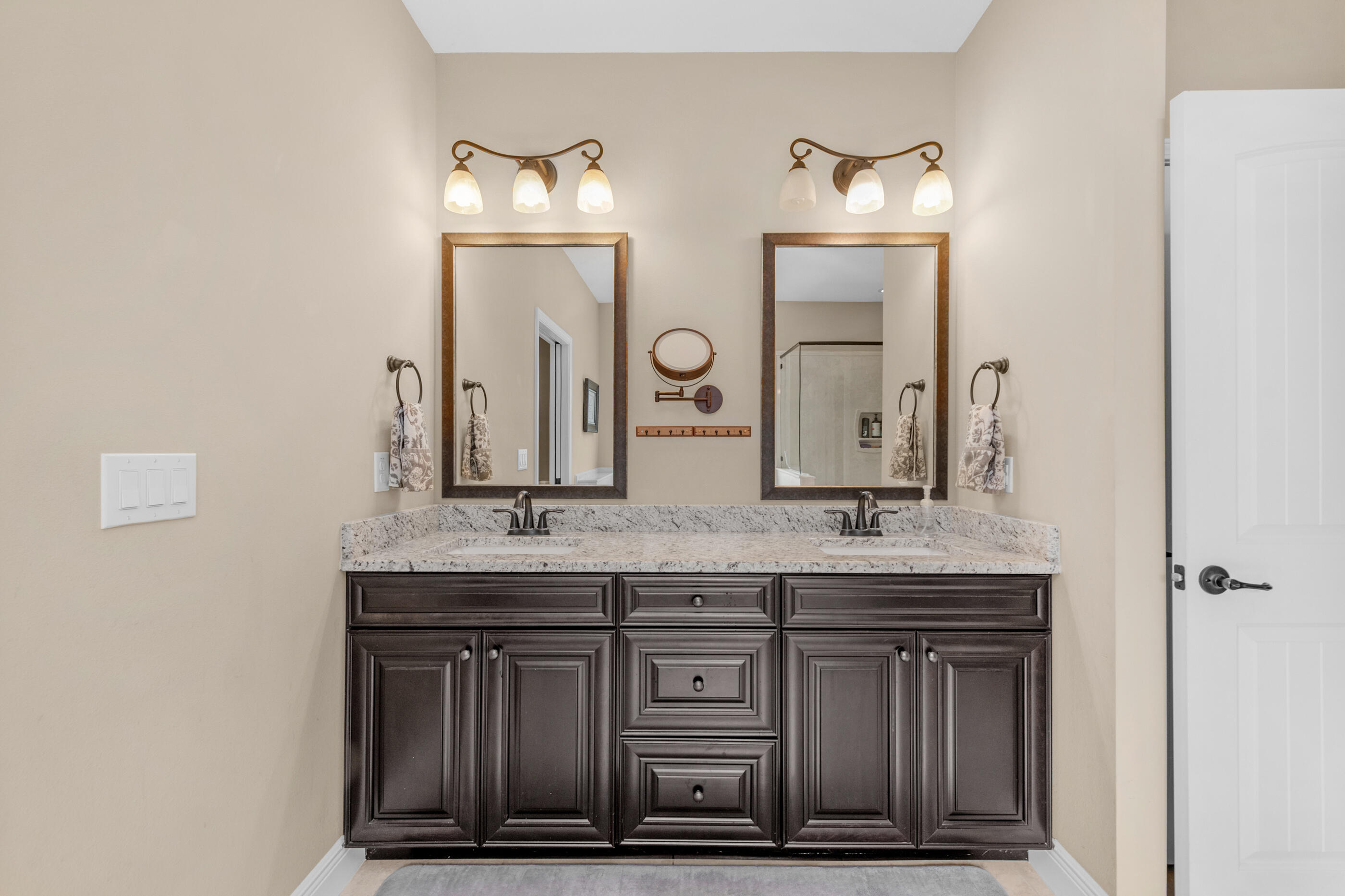 2394 Ellison Way Fort Walton Beach, FL 32547 - Photo 16 of 28 a bathroom with a granite countertop sink and a mirror