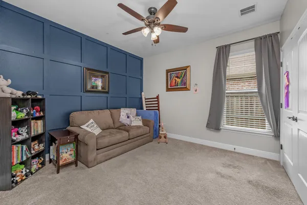 a living room with furniture and a window