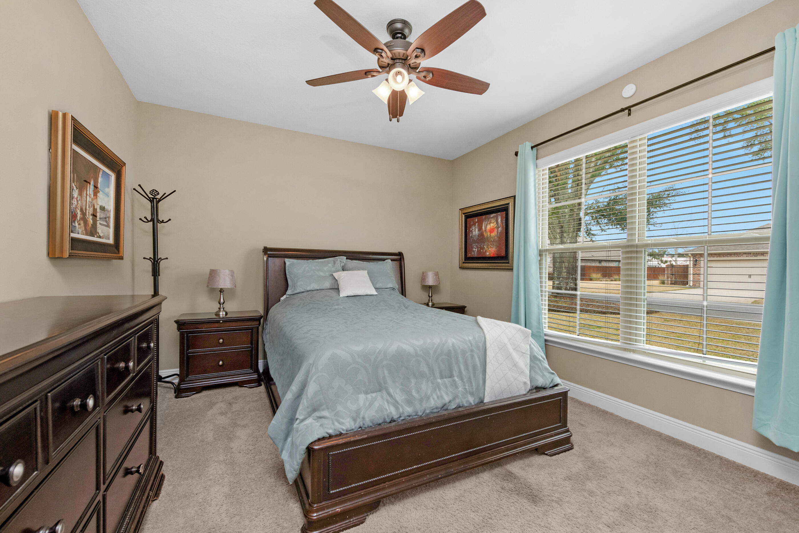 2394 Ellison Way Fort Walton Beach, FL 32547 - Photo 22 of 28 a bedroom with a bed and a large window with a projector