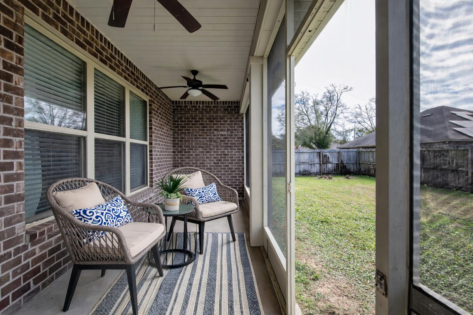 2394 Ellison Way Fort Walton Beach, FL 32547 - Photo 25 of 28 a view of a porch with furniture and yard