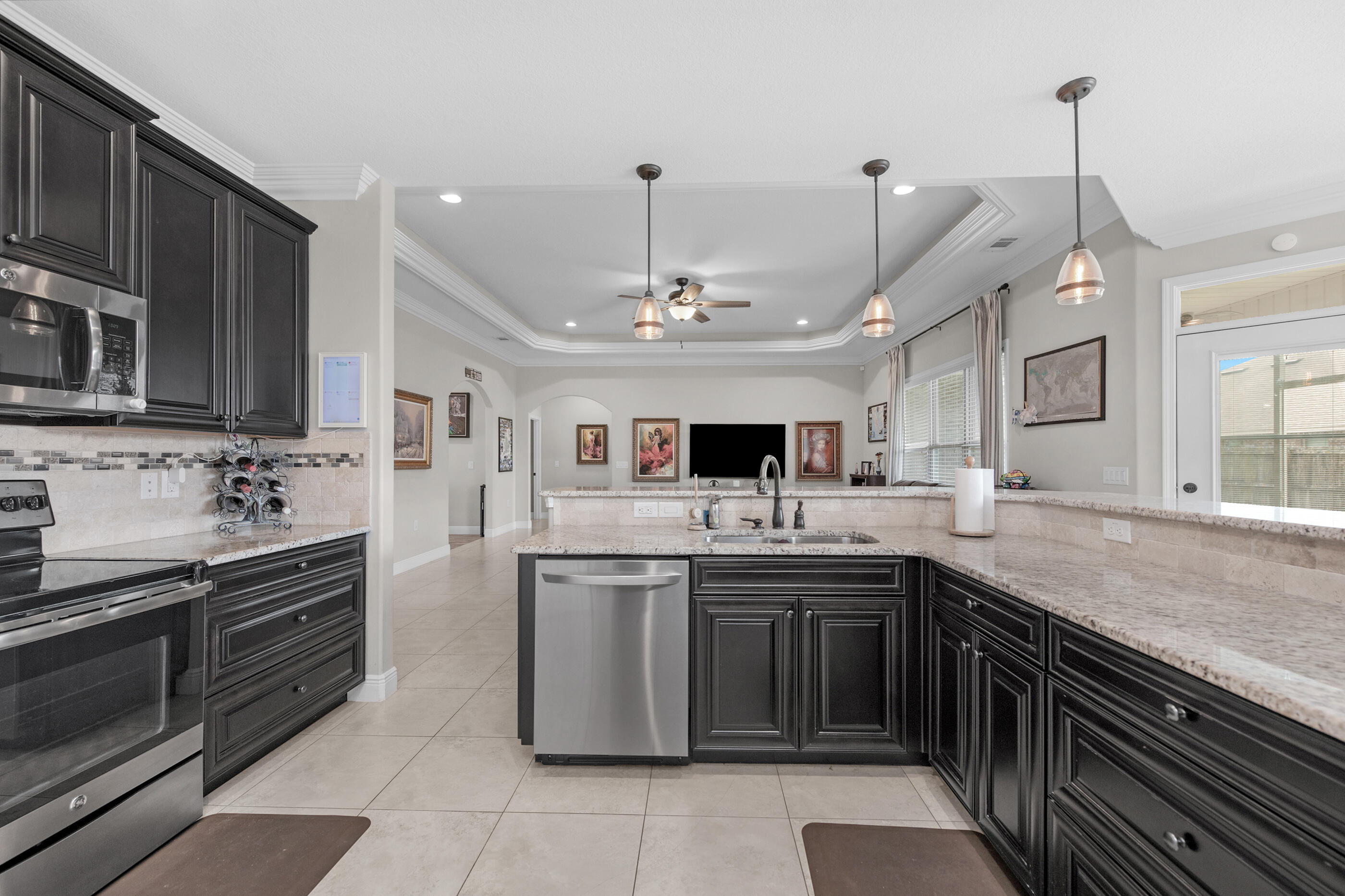 2394 Ellison Way Fort Walton Beach, FL 32547 - Photo 10 of 28 a kitchen with stainless steel appliances a sink stove and cabinets