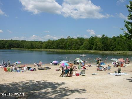 230 Maple Ridge Drive Hawley, PA 18428 - Photo 33 of 35 a view of a lake with a car parked